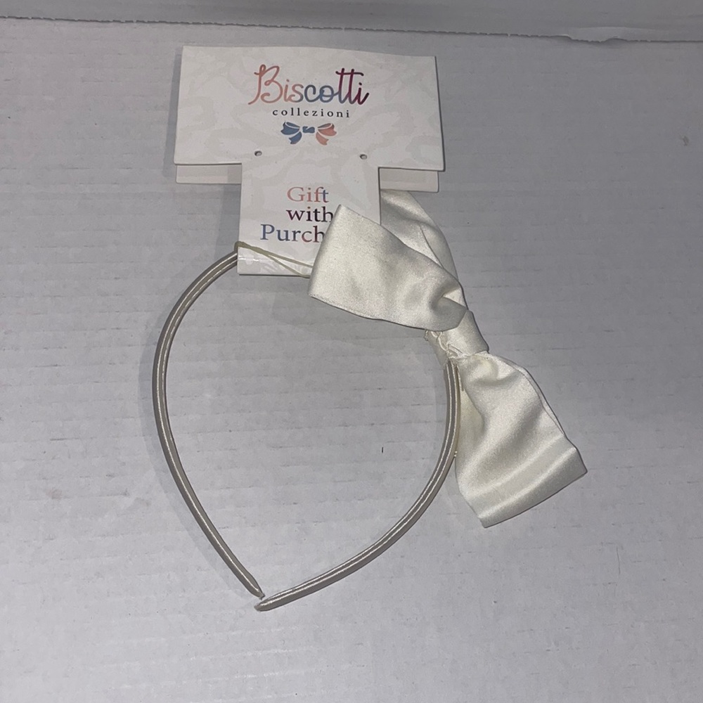 Biscotti collezioni Headband
Cream colored bows with a flexible head band